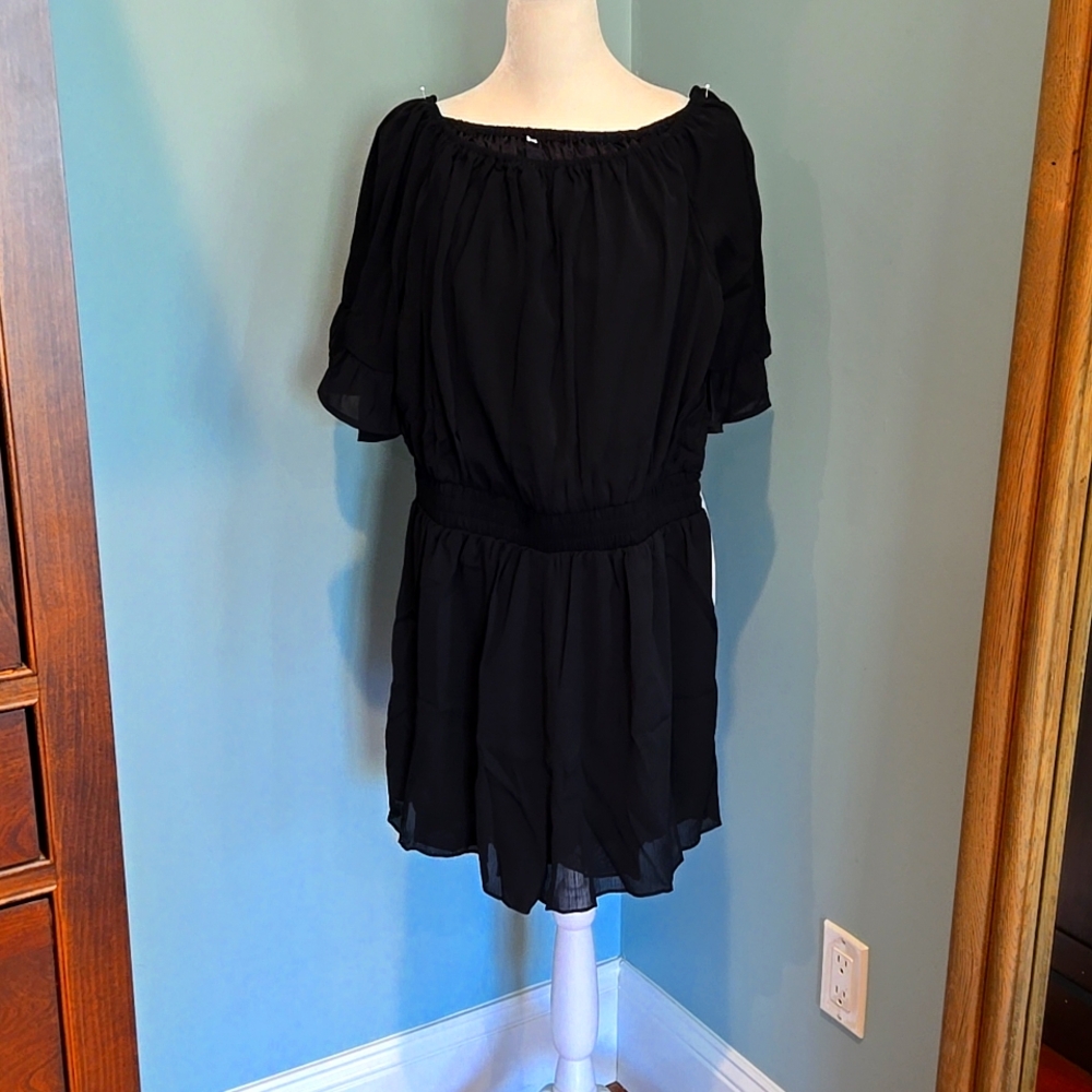 Black romper Size Large. NEVER WORN. New Without Tags.